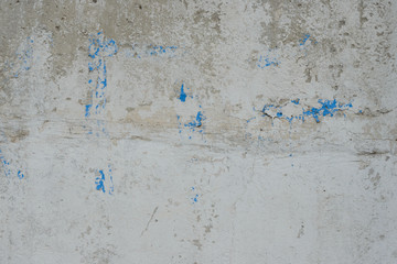 Wall fragment with scratches and cracks