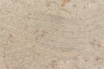  tracks in the sand. Textured background.