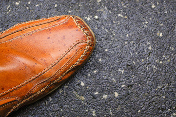 Men's shoes, part of mocassin for autumn on cement ground