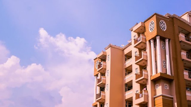 timelapse of monsoon clouds against a skyscraper in delhi