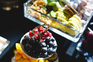 A look from above on tasty berries lying on the plate