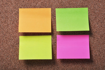 Notice papers on a cork board