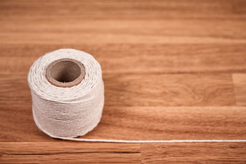 Cord on a brown wooden oiled oak table