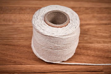 Cord on a brown wooden oiled oak table