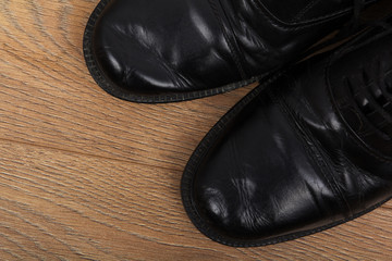 Fototapeta na wymiar Shoes on a wooden floor