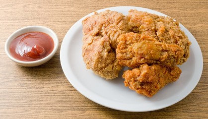 Fried Chicken with Sauce on A White Dish