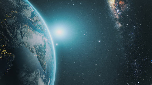 Sunrise over earth as seen from space. With stars background. © janez volmajer