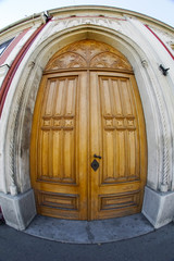 Wooden door with fisheye lens view