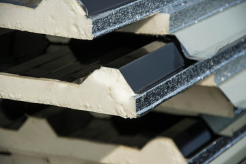 black metal sheet  roof with insulation attached under metal sheet.