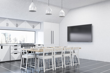 Kitchen interior with fridge and TV set