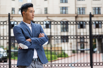Asian businessman waiting for his friend