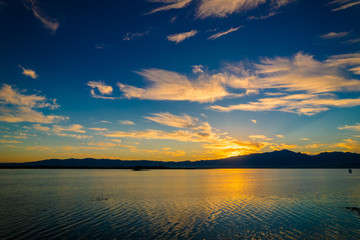 Sunset scene twilight on the lake with blue sky and clounds