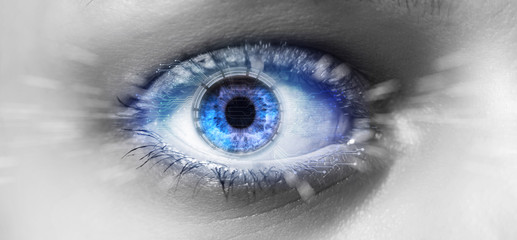 Eye of a woman with digital interface in front of it