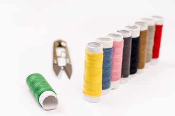 Colorful threads on the white background