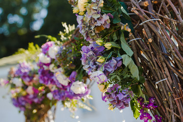 Yellow rose buds put in a wedding altar made of oiser