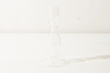 Glass candleholder on the white background