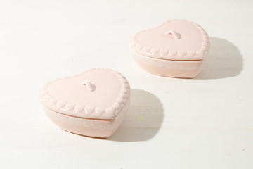 A look from above on porcelain pots standing on the white table