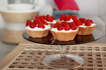 Delicious strawberry cakes on stand