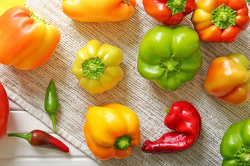 Fototapeta na wymiar Fresh peppers on wooden table