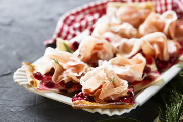 Tart with cream cheese, ham and cranberry