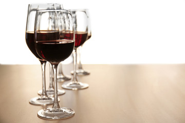 Glasses of red wine on table in restaurant