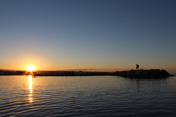 fishermen on the rocks