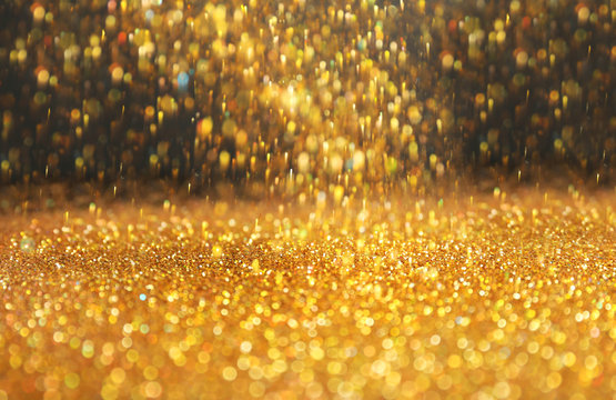 Shining golden sparkles and grey background