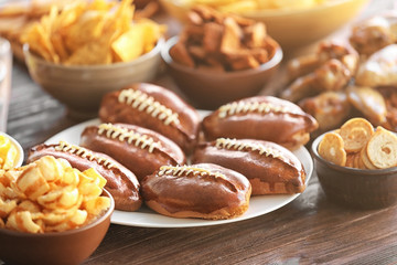 Tasty snacks prepared for super bowl party, close up view