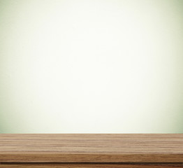 Empty wooden table over blue cement wall  background