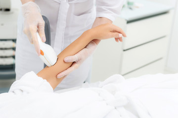 Healthy woman getting ultrasound skin care procedure