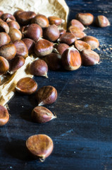 Fresh chestnuts on wooden table