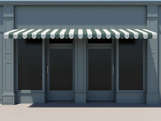 Classic shopfront with two doors, large windows and awnings. 