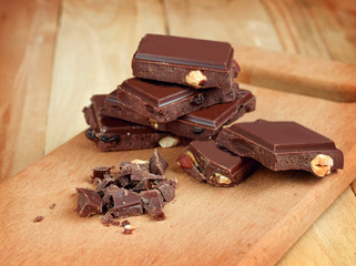 Chocolate chips and pieces of chocolate. Close-up. Holiday chore