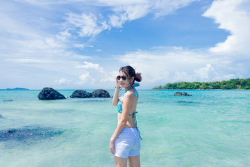 A girl happy at the beach