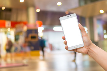 Women hand holding white mobile smart phone with white blank iso