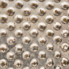 part of old rusty metal grater surface