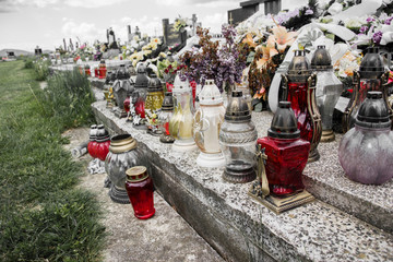 Votive candles lantern on the grave in Slovak cemetery. All Saints' Day. Solemnity of All Saints. All Hallows eve. 1st November. Feast of All Saints. Hallowmas. All Souls' Day