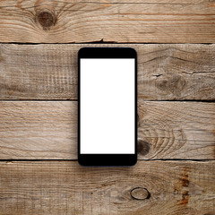 Smartphone with blank screen on wooden background