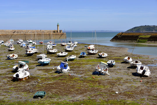 Port and lighthouse at low tide at Binic, commune in the C&ocirc;tes-d'Armor department of Brittany in north-western France.
