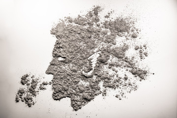 Man head spiting dust drawing in grey ash