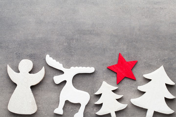 Fototapeta na wymiar Christmas background. White tree decorations on a gray backgroun