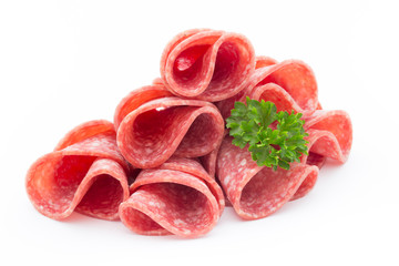 Salami sausage slices isolated on white background.