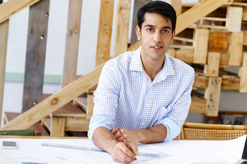 Young man architect in office