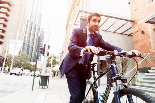 Young businessmen with a bike