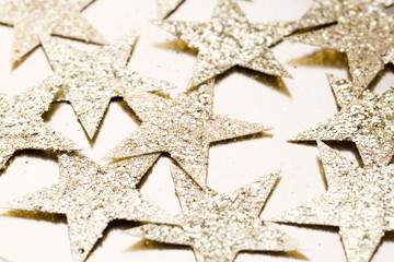 Christmas gold stars decoration on abstract background.