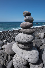 Huge amount of zen stones piled in the beach, Puerto de la Cruz,