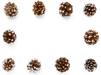Background Frame out of snowy Pine Cones. Hand painted white for a festive winter look and isolated on white background. 