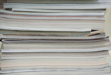 Many old books in a book shop or library.