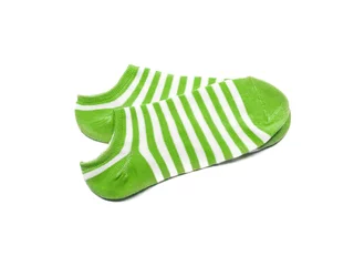 Zelfklevend Fotobehang Child's striped socks, green sock for backgrounds or textures. © StockGood