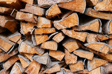 Chopped firewoods for the fireplace  stacked for winter